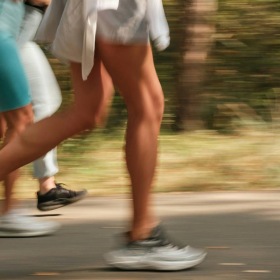 a group of people running on a road