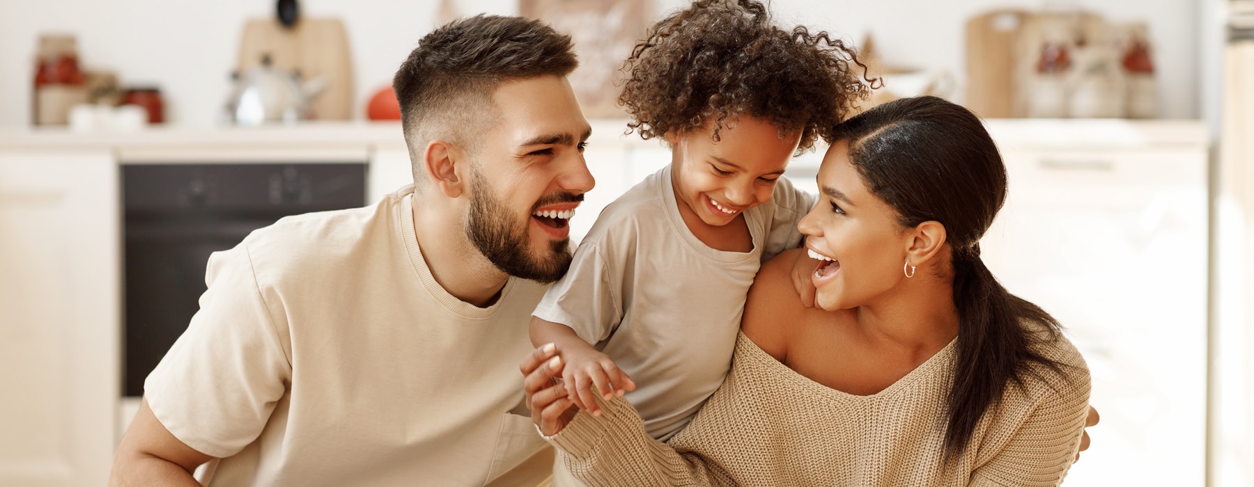 man woman and child laughing